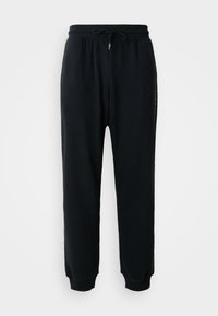 Schwarze Sweatpants aus weichem Baumwollmaterial mit elastischem Bund und Kordelzug, gerippten Bündchen und seitlichem Logodetail.