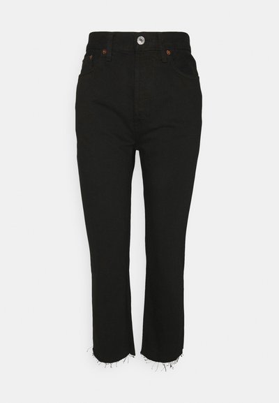 Black denim jeans with a high waist, five pockets, a zip-fly, and a raw hem. Features copper rivets and a silver button closure.