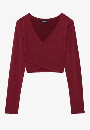 Bordeaux lange mouwen wikkeltop van een soepel materiaal, met een diepe V-hals en een cropped zoom met een gelaagd ontwerp.