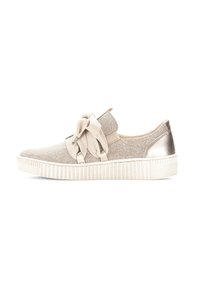 Beige sneaker with a textured fabric upper, featuring a large bow and metallic heel accent, set on a white, ridged rubber sole.