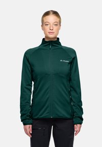 Giacca zip-up verde scuro in tessuto testurizzato, con colletto alto e due tasche laterali. Presenta un design minimalista e un logo bianco sul petto.
