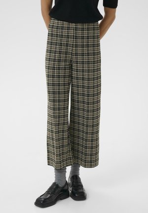 Pantaloni a gamba larga in plaid nero, beige e grigio. Realizzati in tessuto testurizzato con vita alta e un classico motivo a quadri.