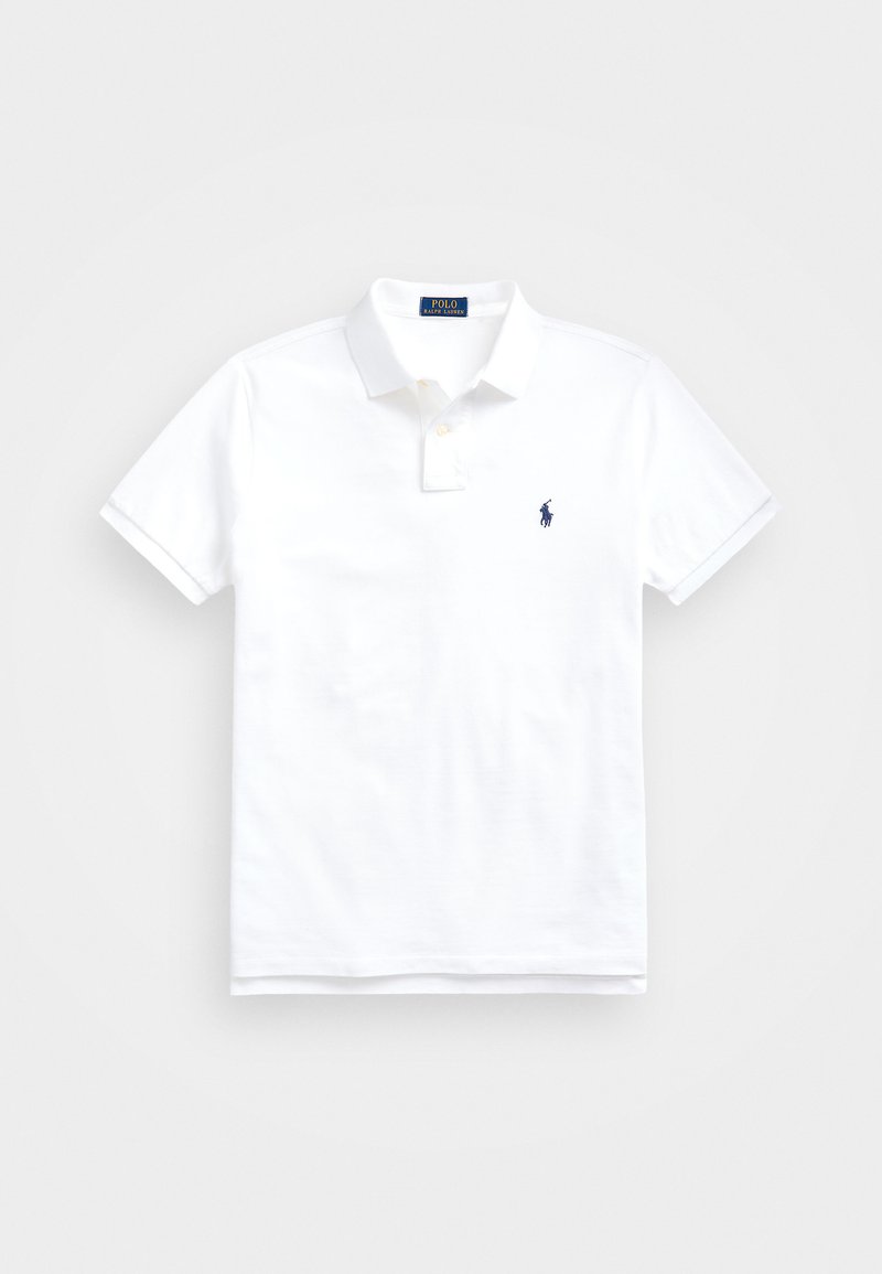 Valge puuvillane polo-särk, klassikalise kraega, lühikeste varrukatega ja vasakul rinnal väikese tumesinise logoga. Kahe nupuga sulgemine.