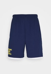 Mörkblå idrottsshorts med elastisk midja och gul text "WOLVERINES 1879 FOOTBALL" på vänster ben, vit meshlager som syns nedanför fållen.