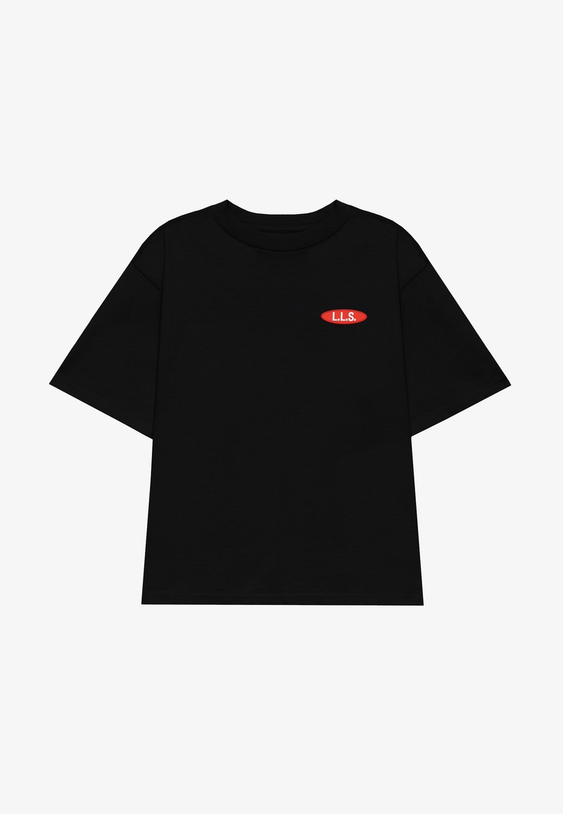 T-shirt noir à manches courtes en coton. Présente un logo ovale rouge avec le texte "L.L.S." sur le devant. Coupe décontractée, col ras du cou.