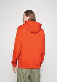 HUGO DARATSCHI - Sweatshirt com capuz - dark orange