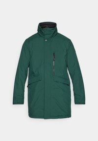 Grønn vanntett parka med høy krage, trykknappslukking foran, glidelåslomme, to sidelommer og rett snitt. Glatt stoff uten mønstre.