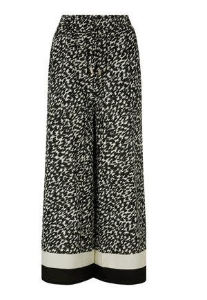 Black and white wide-leg trousers with a textured abstract pattern, drawstring waist, and contrasting white and black hem bands.