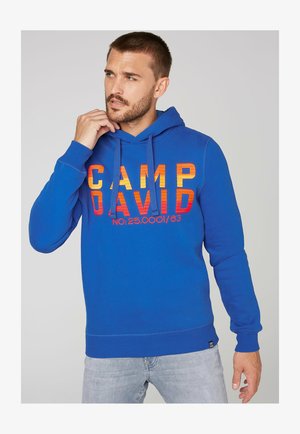 Camp David Felpa Con Cappuccio Uomo Maiorca – Stampa Frontale Effetto Puff, Taglio Ampio, Lavaggio Usato, Colore Vacanza – Modello Alta Moda Sportiva