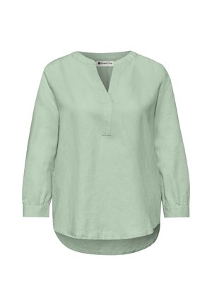 Blouse vert clair à manches longues avec une fente en V au niveau du col, col rond, poignets boutonnés et ourlet légèrement arrondi, devant plus long qu'à l'arrière.