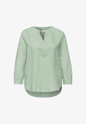 Blouse vert clair à manches longues avec une fente en V au niveau du col, col rond, poignets boutonnés et ourlet légèrement arrondi, devant plus long qu'à l'arrière.