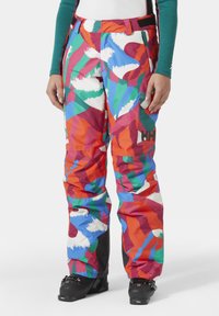 Pantalones de esquí coloridos con un atrevido patrón abstracto en rojo, verde, azul y blanco. Hechos de material duradero con un corte relajado.