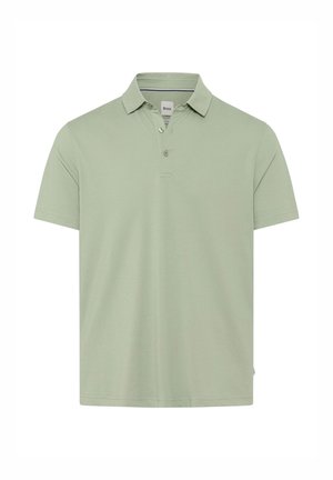 Polo shirt vert clair en tissu lisse, avec un col, une patte de boutonnage à deux boutons et des manches courtes. Aucun motif ni graphique visible.