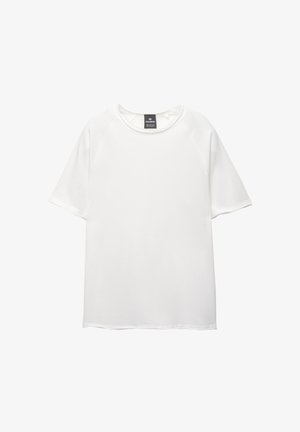 Witte korte mouw t-shirt met een ronde hals, gemaakt van zachte stof. Heeft een rechte snit en geen patronen of accenten.