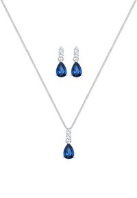Blaue tropfenförmige Edelsteine in silberner Fassung. Halskette mit passendem Paar Ohrringe. Zarte Kette mit feiner Textur, schlichtes Design.