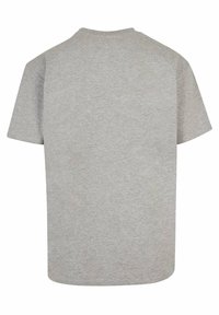 Grå genser t-skjorte med korte ermer, laget av myk stoff, med rund hals og et enkelt, ensfarget design.