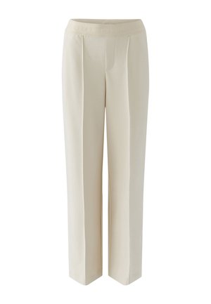 Cream-colored wide-leg trousers made of smooth fabric, featuring a waistband with embossed text and pleats for added detail.