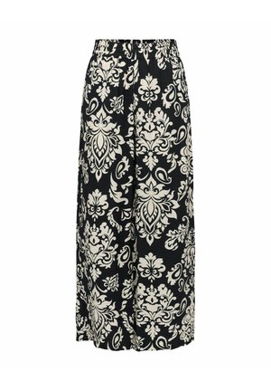 Pantalon noir à jambes larges avec de grands motifs floraux blancs et paisley, avec une taille élastique.