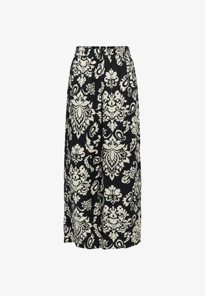 Pantalon noir à jambes larges avec de grands motifs floraux blancs et paisley, avec une taille élastique.