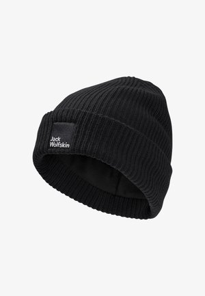 Black knitted beanie with ribbed texture, featuring a fold-over cuff and a small sewn tag with "Jack Wolfskin" in white.
