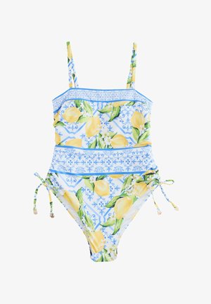 Maillot de bain une pièce avec motif citron jaune et feuilles vertes sur fond blanc, bande décorative bleue à la taille et bretelles.