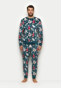 Męski zestaw piżamowy wykonany z ciemnozielonego materiału z wesołym nadrukiem psów w różnych kolorach. Zawiera długie rękawy i spodnie z ściągaczami.