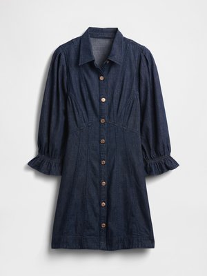 Vestido de mezclilla azul oscuro con botones en la parte delantera, cuello con solapa y mangas abullonadas con puños elásticos. Presenta costuras decorativas y botones de madera.