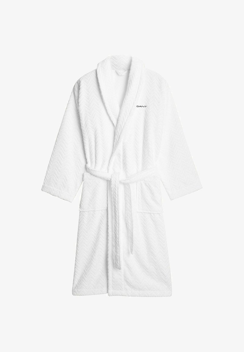 Peignoir blanc en coton texturé avec un motif chevron, doté d'un col châle, d'une ceinture à la taille et de deux poches avant ; logo de la marque sur la poitrine.