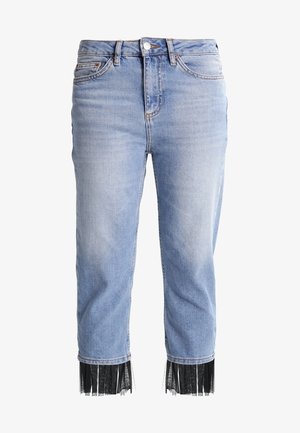 Light blue denim jeans with a cropped fit and black fringe detailing at the hems. Classic five-pocket design and front button closure.