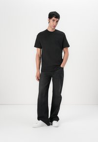 Lacoste Marškinėliai su spaudiniu - black