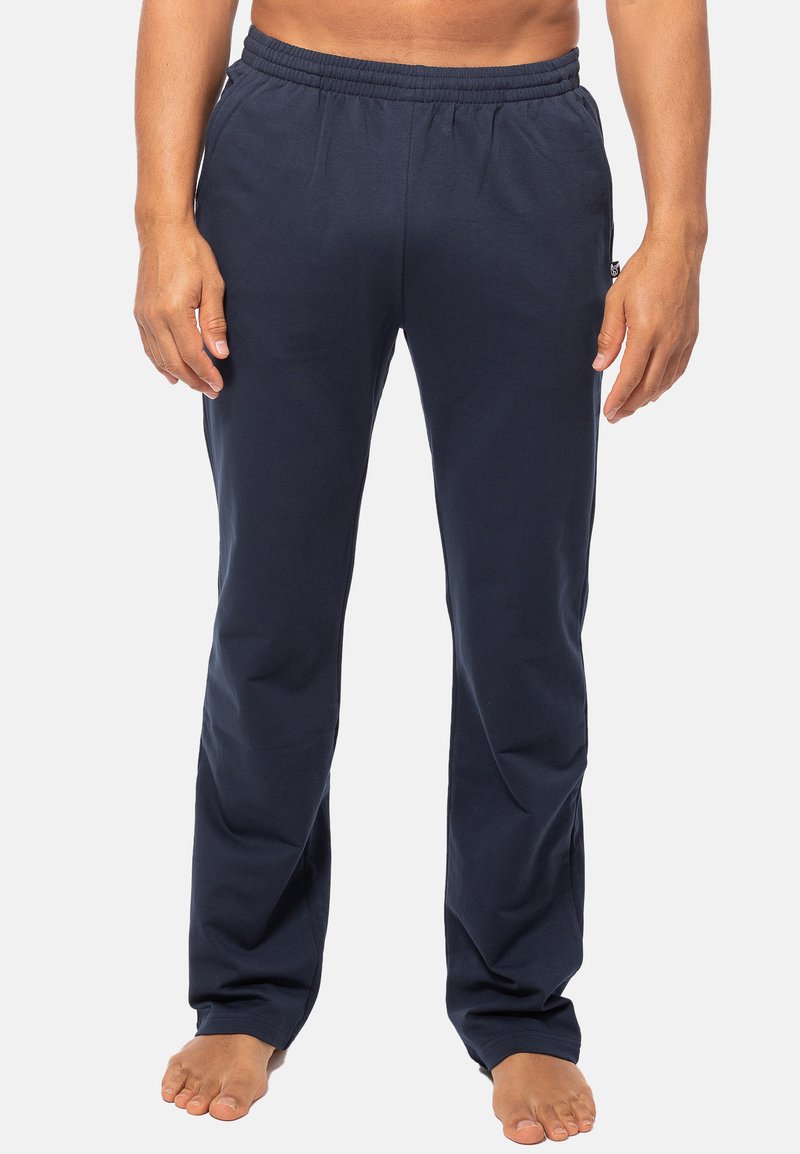 Marineblauwe katoenmix broek met een elastische tailleband en zijzakken; rechte snit. Zachte textuur, geschikt voor casual draag.