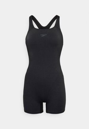 Svart baddräkt med racerback-design, kort benöverdragning och en slät yta. Har liten logotyp på framsidan.
