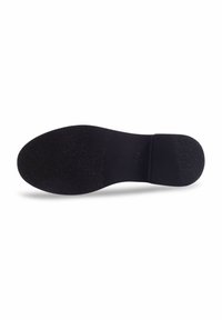 Semelle de chaussure noire avec une surface texturée, forme arrondie et une section lisse près du talon. Design minimaliste sans marque visible.