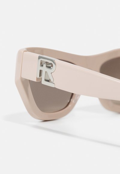 Pink plastic sunglasses with angular frame, tinted lenses, and a metallic 'R' logo accent on the temple. Smooth texture with a glossy finish.