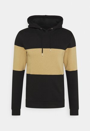 Hooded sweatshirt with black top, cuffs, and bottom, and a wide beige horizontal stripe across chest and arms, featuring front pocket and drawstrings.