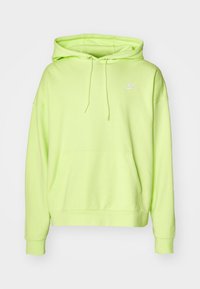 Lysande neongrön hoodie i mjukt tyg, med en framficka, justerbar dragsko och en liten vit logotyp på bröstet.