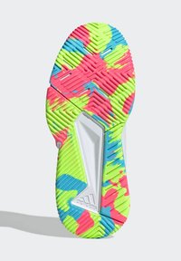 Multicolored outsole featuring vibrant pink, green, and blue patterns, with textured grooves for traction and a distinctive angular shape.