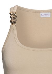 Beige tank top featuring a smooth texture, round neckline, and gold-toned chain accents on the shoulder straps. Brand label visible.