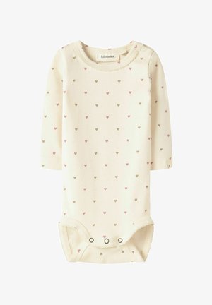 Cream long-sleeve baby bodysuit with small pink and beige heart pattern, round neckline, and snap closures at the bottom.