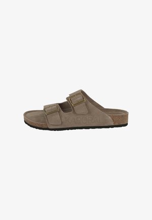Beige suede sandals with two adjustable straps and gold-tone buckles. Cork footbed with a textured black rubber outsole. Brand name embossed on side.