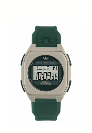 Montre de sport numérique avec bracelet vert, boîtier beige, affichant l'heure 10:09:36, jour mercredi 14, avec alarme et fonction anti-chocs.