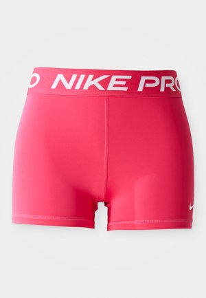 Shorts Nike Pro de culoare roz aprins, fabricate dintr-un material elastic. Prezintă o bandă largă albă la talie cu textul 'NIKE PRO' și un mic logo pe lateral.