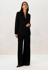 MIT GLITZER - Broek - schwarz