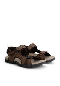 Brown sandals made of synthetic material with two adjustable straps, mesh panels, and a textured rubber sole for grip.