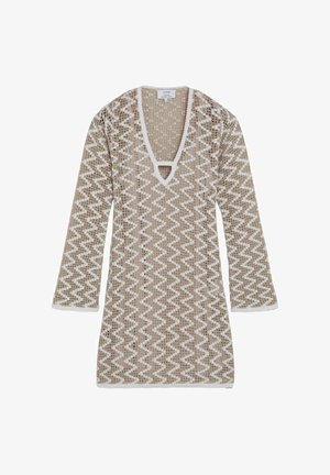 Vestido de punto de manga larga en beige y blanco con patrón de zigzag, escote en V pronunciado y ribete con borde ondulado en los bordes y puños.