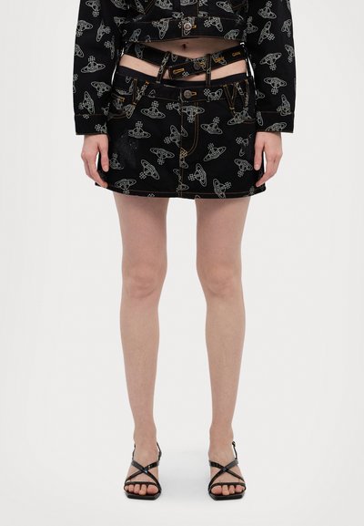 Black denim mini skirt featuring a futuristic spaceship pattern in white, accented with yellow stitching and button closure.