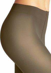 Leggings verde oliva realizzati in materiale stretch a coste. Design a vita alta con superficie liscia e finitura senza cuciture.