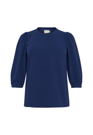 Tumši zilas krāsas krekls ar apaļu kakla izgriezumu, puffed piedurknēm un brīvu piegriezumu. Izgatavots no mīksta auduma ar gludu tekstūru un minimālu detaļu skaitu.