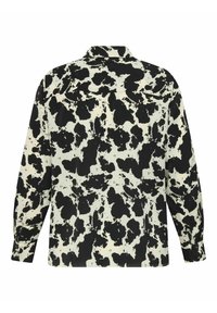 Sort og hvid ko-print skjorte med lange ærmer, krave og knappede manchetter. Lavet af et glat stof med en afslappet pasform.