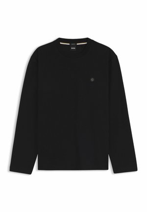 Black long-sleeve crewneck shirt with subtle logo on left chest and small brand tag inside collar.